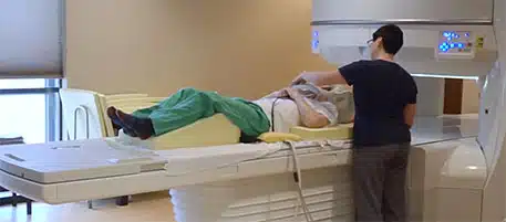 Tech performing Brain MRI on patient