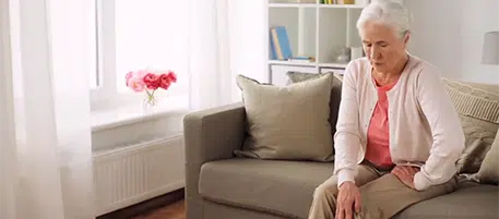 woman holding her leg